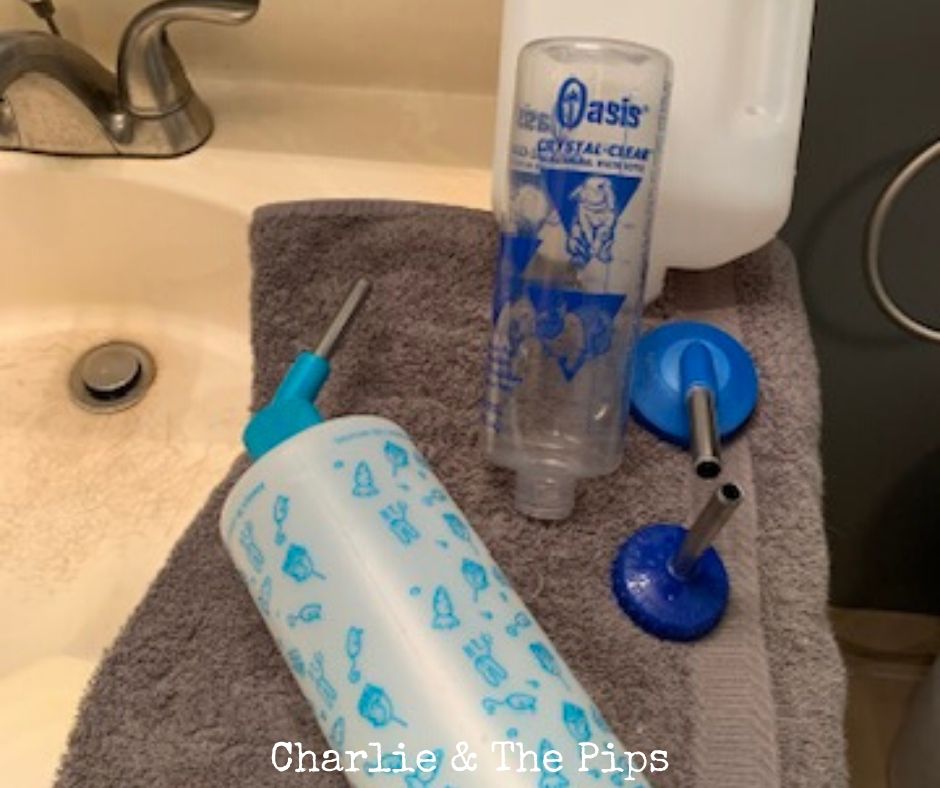 assortment of clean rabbit water bottles